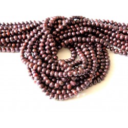 Strand of garnet color pearls